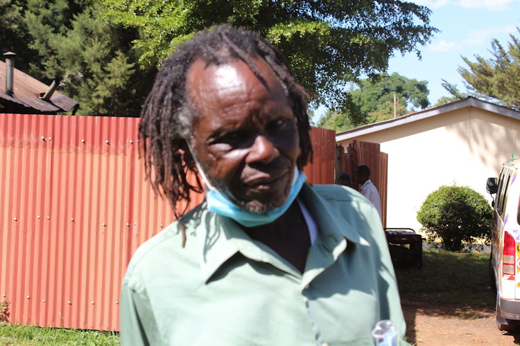 Cosmos Chemwotei, a member of the Ogiek community, outside the court