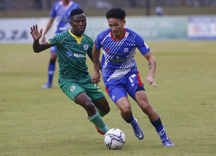 Thami Masiya of Baroka and Daylon Claasen of Maritzburg United in action during their DStv Premiership match at Harry Gwala Stadium in Pietermaritzburg.