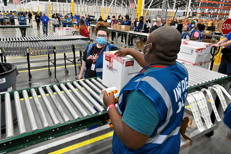 A box containing the Johnson & Johnson Covid-19 vaccine heads down the conveyor at a facility in Shepherdsville, the US, March 1 2021. Picture: TIMOTHY D EASLEY/REUTERS