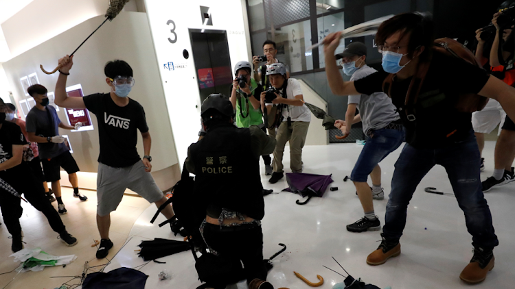 Rioters beat up a plainclothes police officer at Sha Tin District of East New Territories, Hong Kong, China, July 14, 2019. At least 12 police officers were hospitalised.