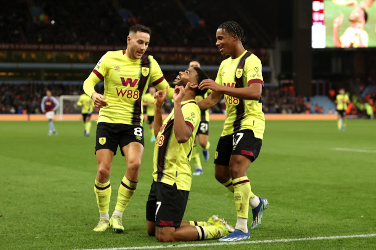 Lyle Foster celebrates with teammates after scoring Burnley's second goal in the Premier League match against Aston Villa at Villa Park in Birmingham on Saturday.