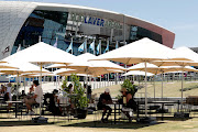 Fans seen relaxing outside the Rod Laver Arena at Melbourne Park. 