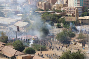 Protesters take part in a march against the military rule amid tear gas fired by security forces, in Khartoum, Sudan February 7, 2022. 