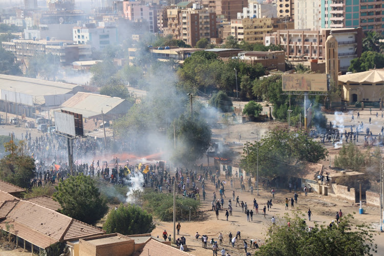 Protesters take part in a march against the military rule amid tear gas fired by security forces, in Khartoum, Sudan February 7, 2022.