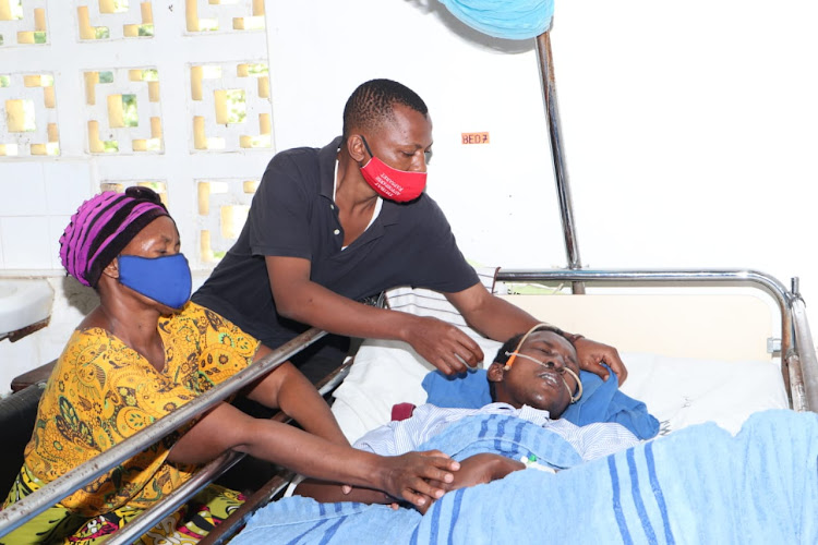 Annrose Waruguru and her firstborn son Maina Macharia attend to her second born son Joseph Macharia at Port Reitz hospital on Wednesday.