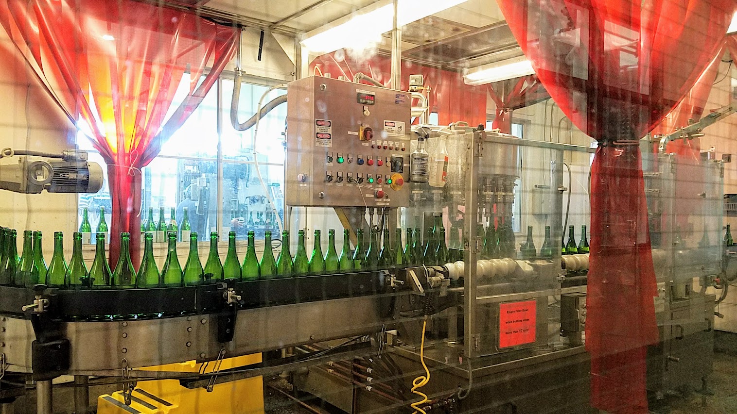 Bottling process for the sake that can be seen during the free self guided brewery tour at Gekkkeikan Sake in Folsom, California