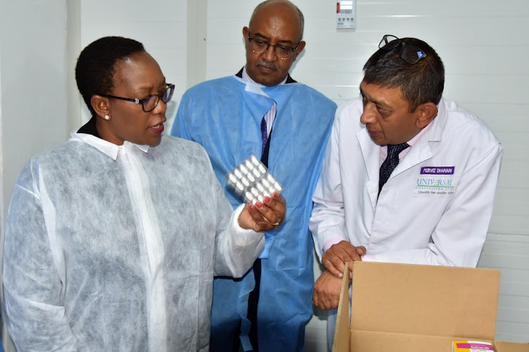 Health CS Sicily Kariuki, CAS Rashid Aman and Universal Corporation CEO Perviz Dhanani when the CS visited the factory on Monday.