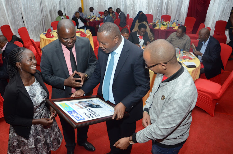 The Star senior digital reporter Nancy Agutu with Radio Africa Group Head of Content Paul Ilado and Radio Africa Group Digital Editor Oliver Mathenge during the handing over of the 2018 Persons of the Year award to DCI boss George Kinoti on Friday, December 21, 2019