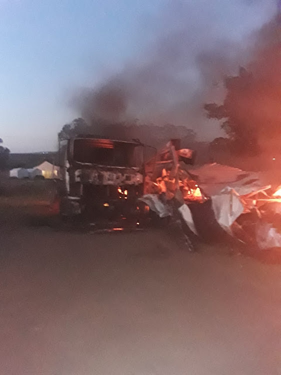 A truck burns after at a Peddie satellite office belonging to Amathole district municipality that was set alight on Wednesday.