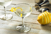 A classic Vesper martini, garnished with a sliver of lemon rind.