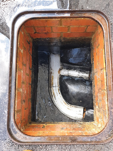 Unblocked manhole chamber, walls cleaned and surface washed down