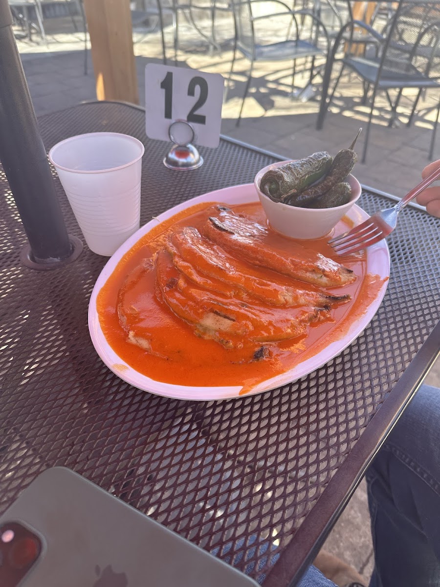 Their pupusa in red chile sauce and fried jalapenos