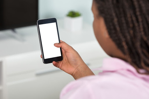 The girl was shot in her arm as robbers took her phone. Stock photo.