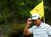 Japan's Hideki Matsuyama acknowledges the crowd after holing his eagle putt on the 15th green during the third round of the Masters at Augusta National Golf Club in Augusta, Georgia, in the US April 10, 2021.