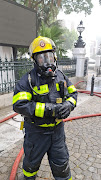 A firefighter at parliament in Cape Town