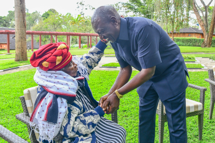 President William Ruto receiving a hug from Field-Marshal Muthoni wa Kirima at Sagana State Lodge on August 8, 2023