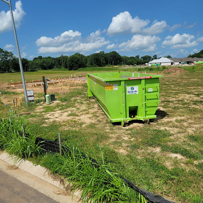 Construction dumpster sitting onsite in Lafayette, LA from Dumpit.biz