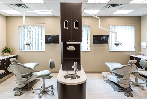 Menon Periodontics and Implants, LLC Logo