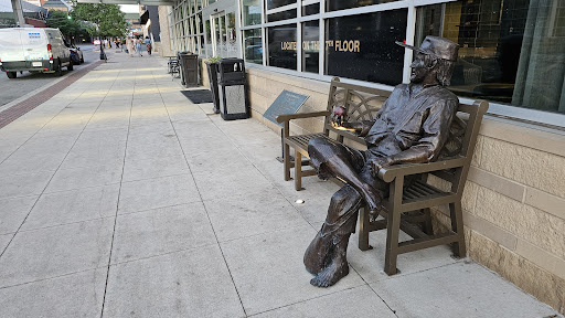 Johnny Appleseed statue on bench - Thumbnail