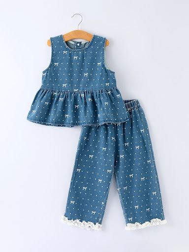 Two-piece children's outfit on a wooden hanger with lace trim at Winged Star Boutique Clarksville IN