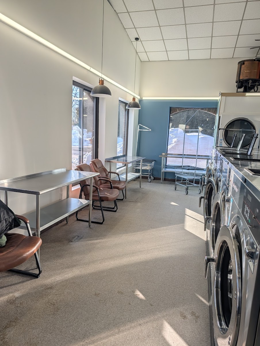 Clean laundry equipment at Bird Bath Laundry Center in Manchester, NH