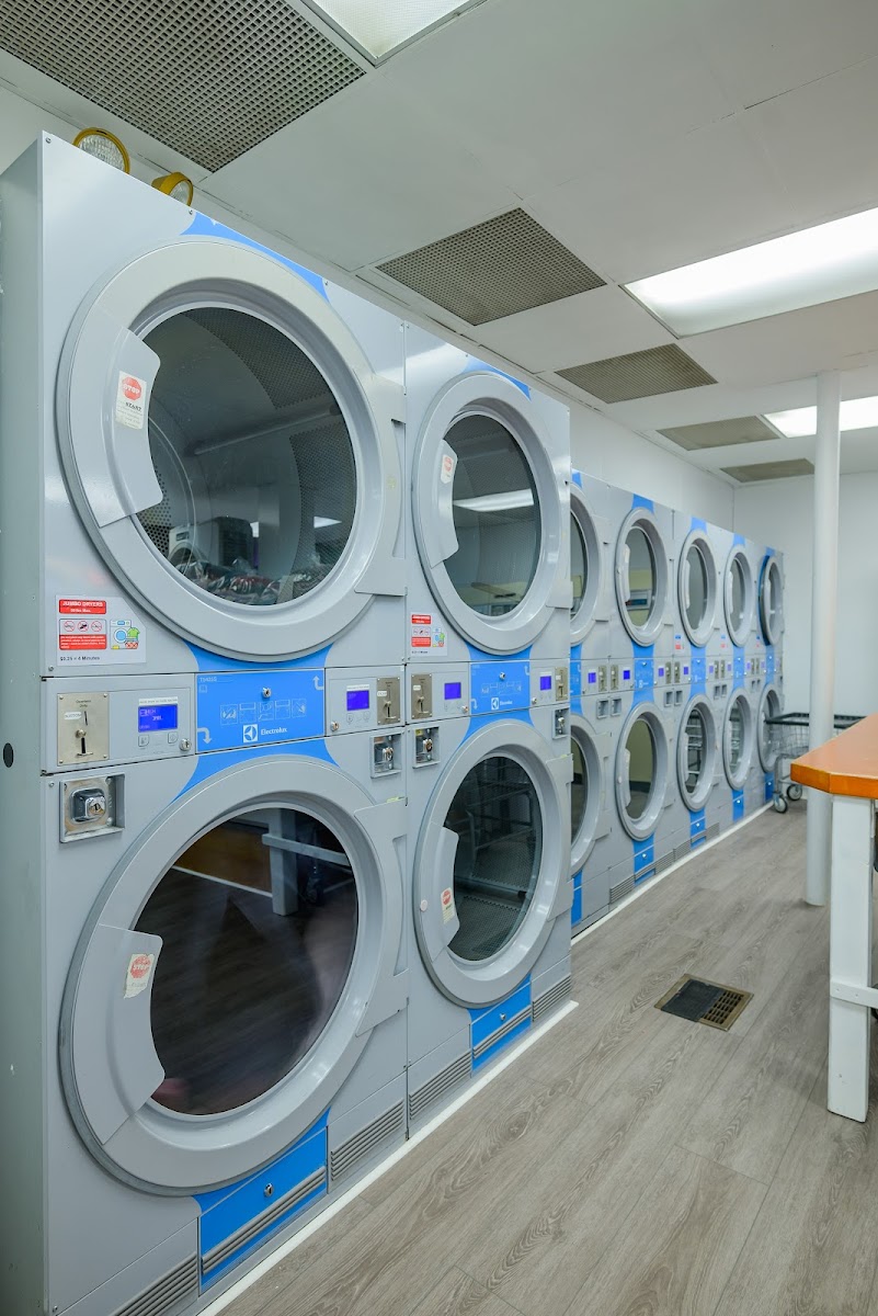Clean laundry equipment at Beacon Street Laundromat in Boston, MA