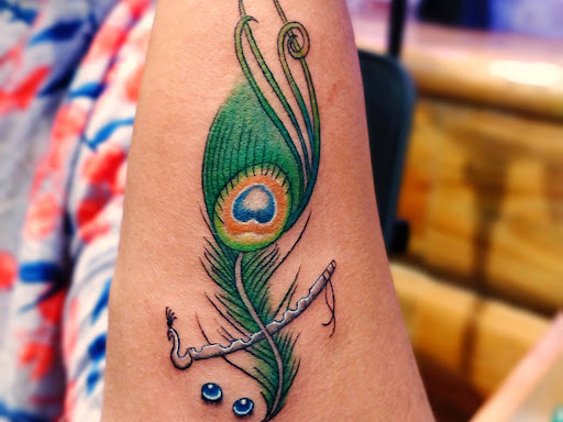 #krishnatattoo #krishnatattoos #feathertattoo #tattooforgirl #wristtattoos #peacockfeathertattoo…