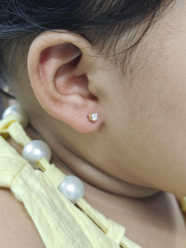 Painless Ear Piercing pure gold with diamond post image