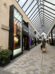 Photo n°1 de Coach Outlet - Giverny MacArthurGlen à Douains (Magasin de maroquinerie)