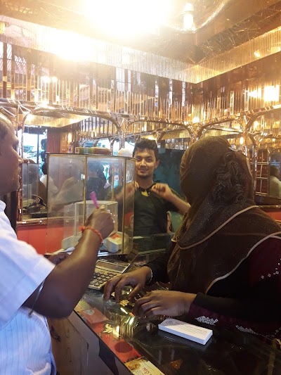 Photos of Shafayet Ullah Market & Rita Pharmacy.