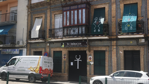 Jamones Tomás Castaño. Amor ibérico esde 1890. Tienda/Almacén. Jamones de Huelva Logo