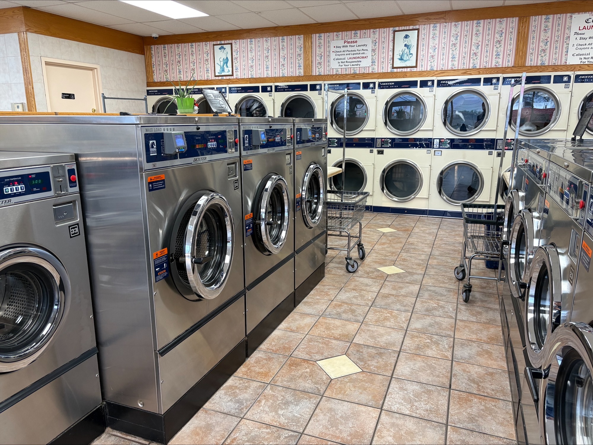 Clean laundry equipment at Colonial Laundromat in Liverpool, NY