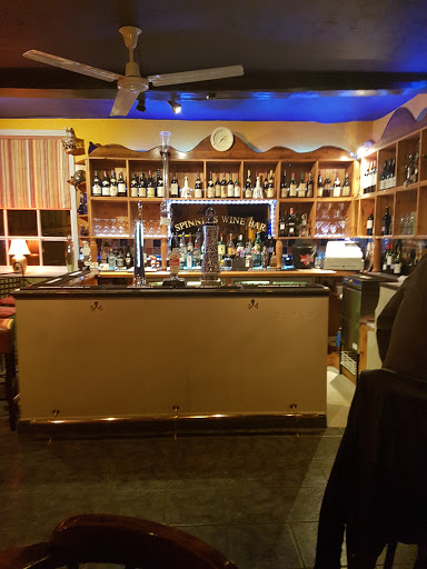 The Spinning Wheel Restaurant & Wine Bar Logo
