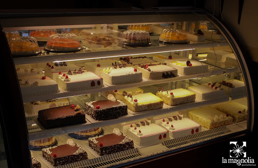 the patisseries magnolia Logo