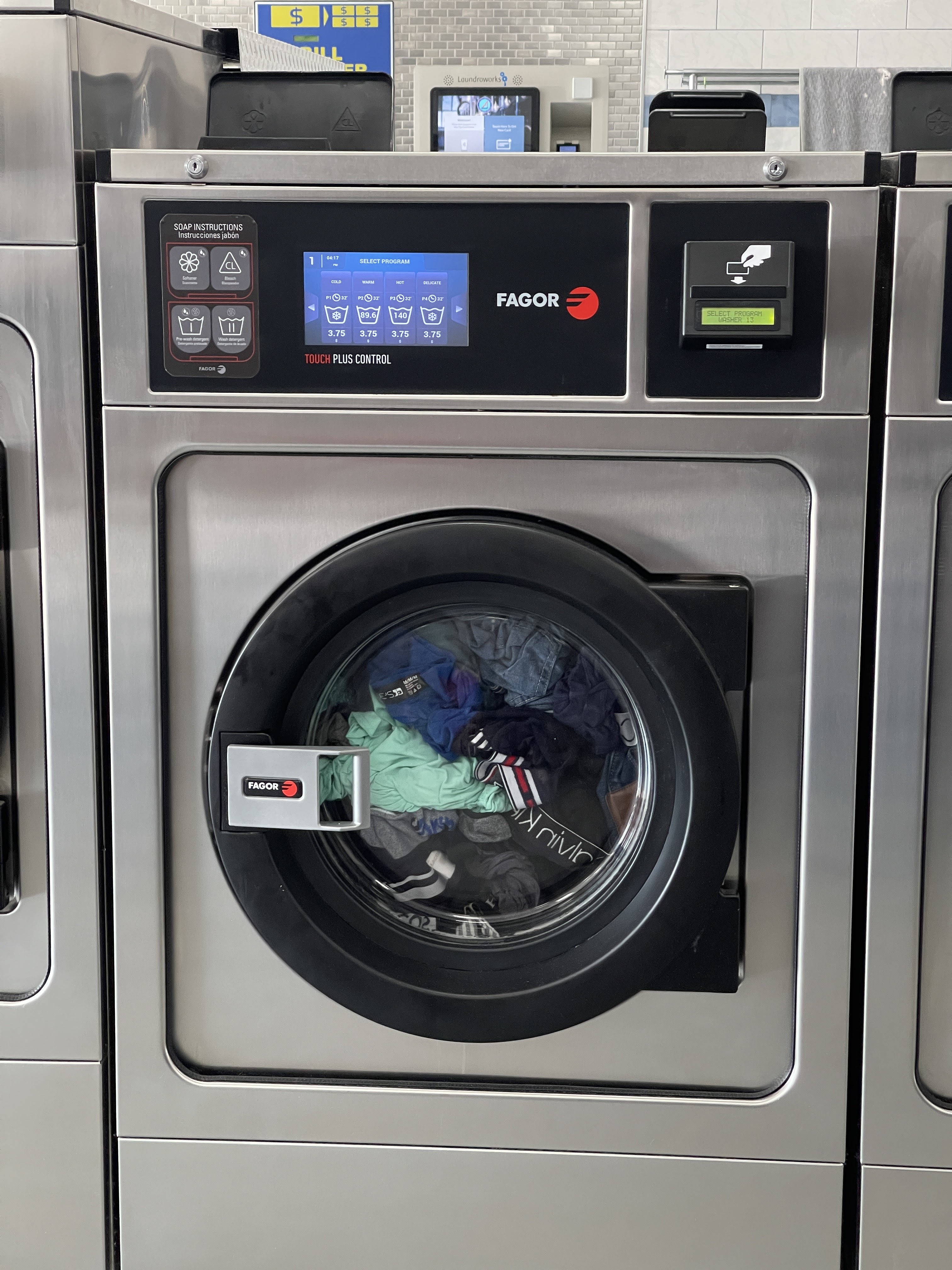 Atlantis Super Wash Laundromat storefront and entrance in Brooklyn