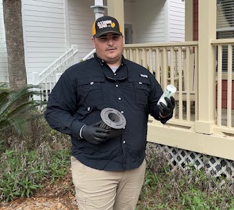 pest control technician applying termite treatment