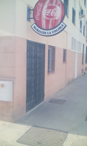 Asador De Pollos La Colora Logo