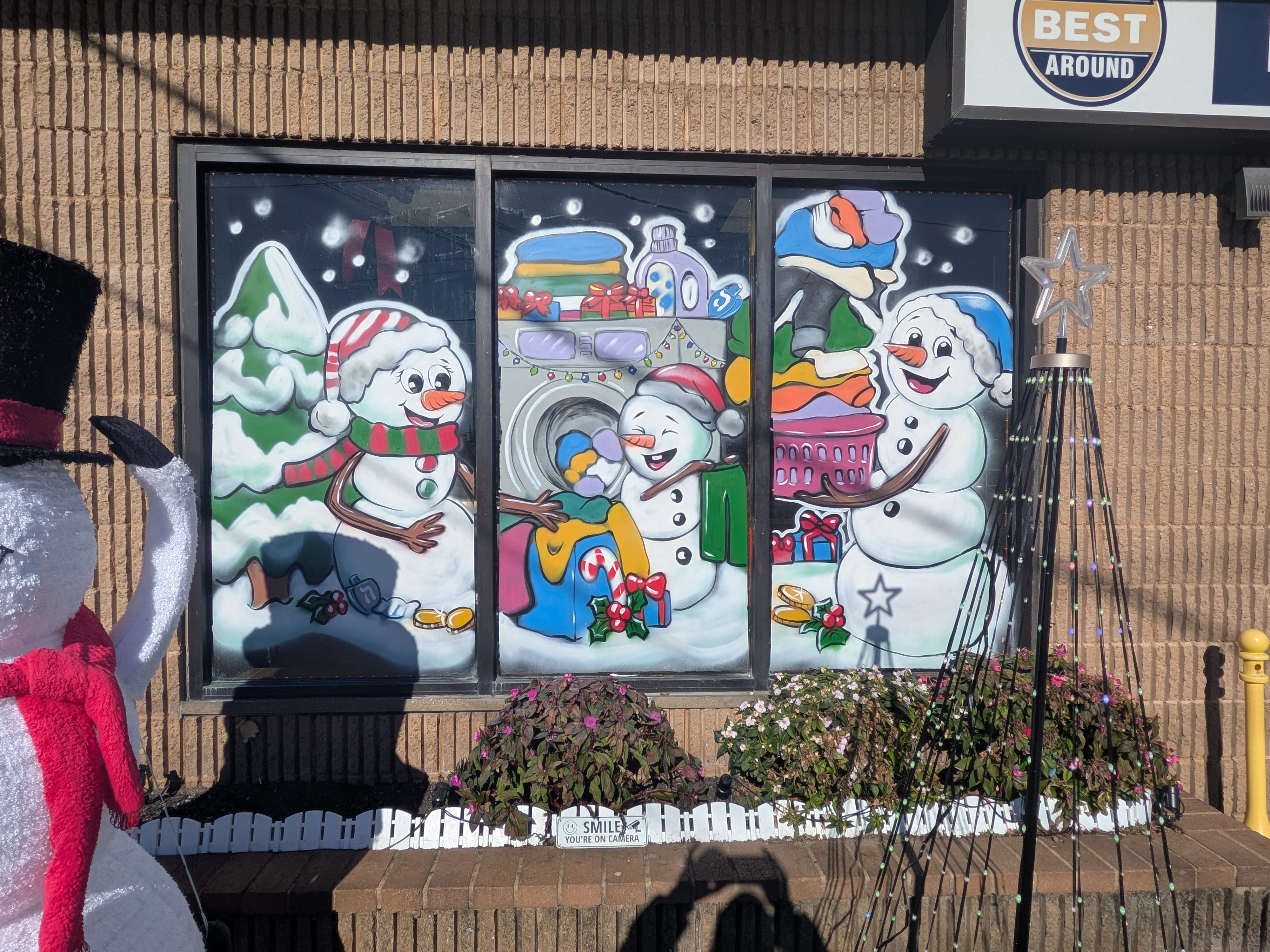 The Best Around Laundromat storefront and entrance in Babylon