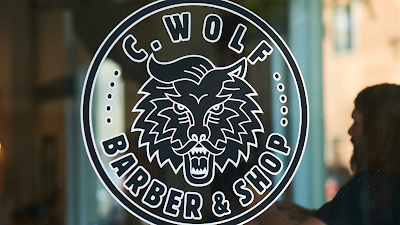 C. Wolf Barber & Shop