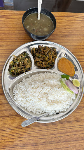 Just at 130 Veg khana Unlimited for a Per person , Rice , Daal , 2 types of vegetables , achar, V…