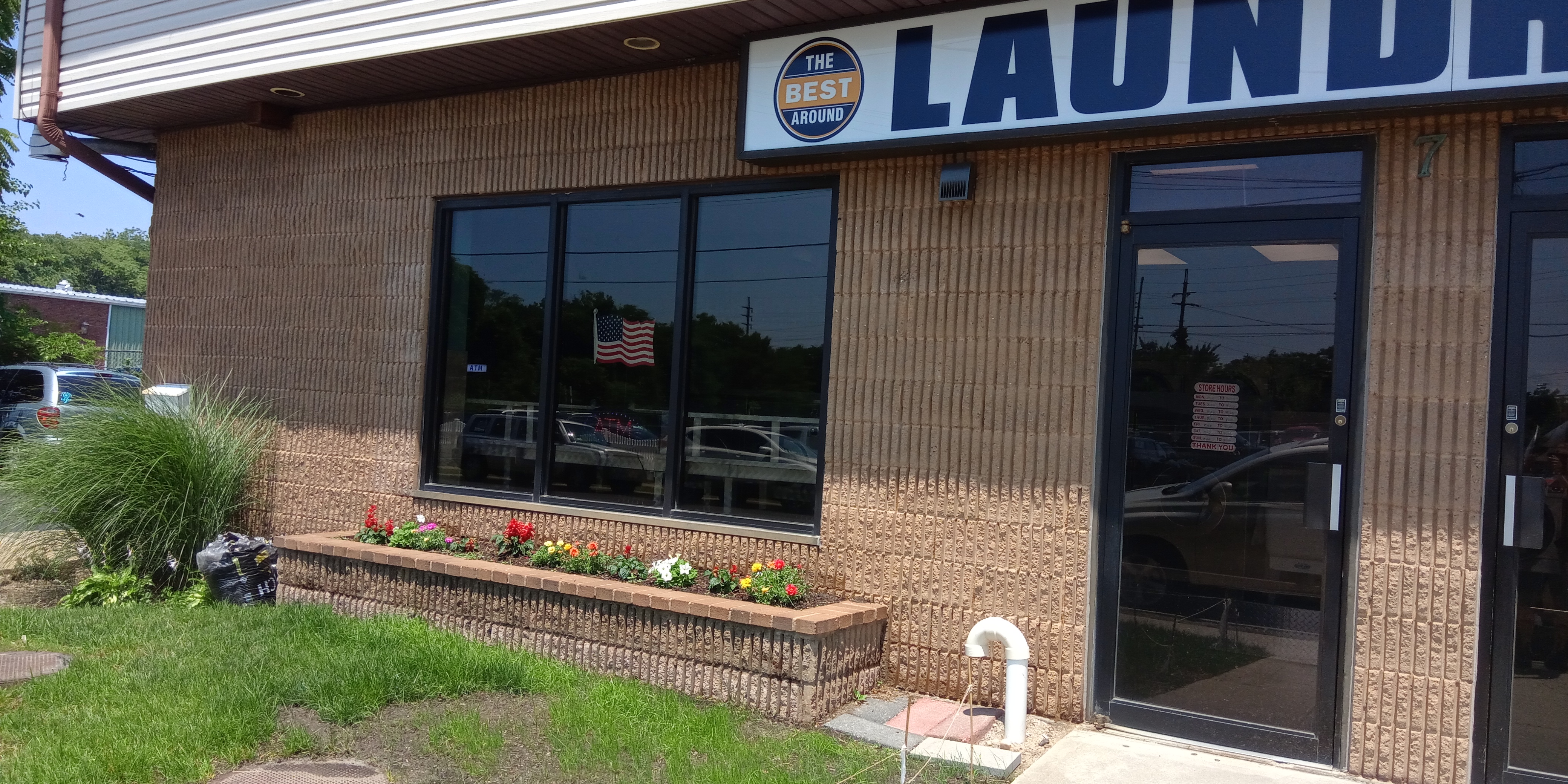 The Best Around Laundromat storefront and entrance in Babylon