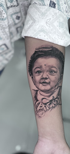 Realistic baby portrait tattoo by Swapnil @ King Tattoos & Training Institute, Pune. post image