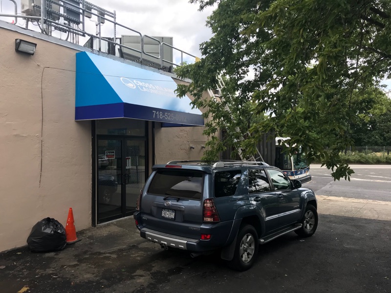 Cross Island Laundromat facility with washing machines in Cambria Heights