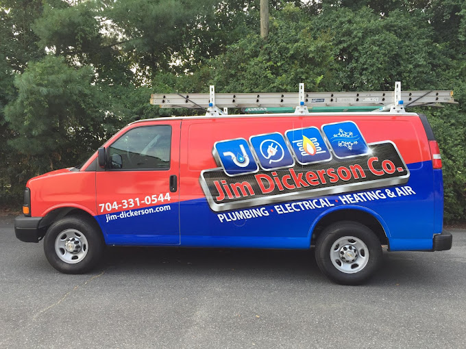 Jim Dickerson red & blue truck with ladder attached to roof