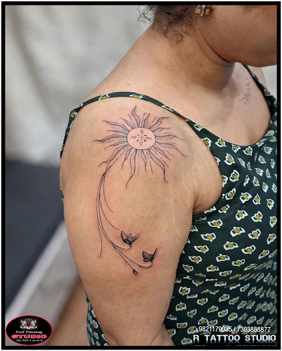 ✨ Stunning Custom Fine-Line Sun & Floral Shoulder Tattoo Art! ✨Looking for a unique, clean, and e… post image