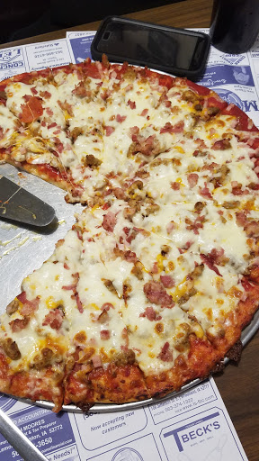 Monty's Pizza And Grill Logo