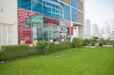 Photos of Rich Rose. ae , Say It With Flowers