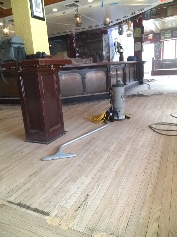 Valle Hardwood Floors LLC laundromat interior in Bridgeport, CT