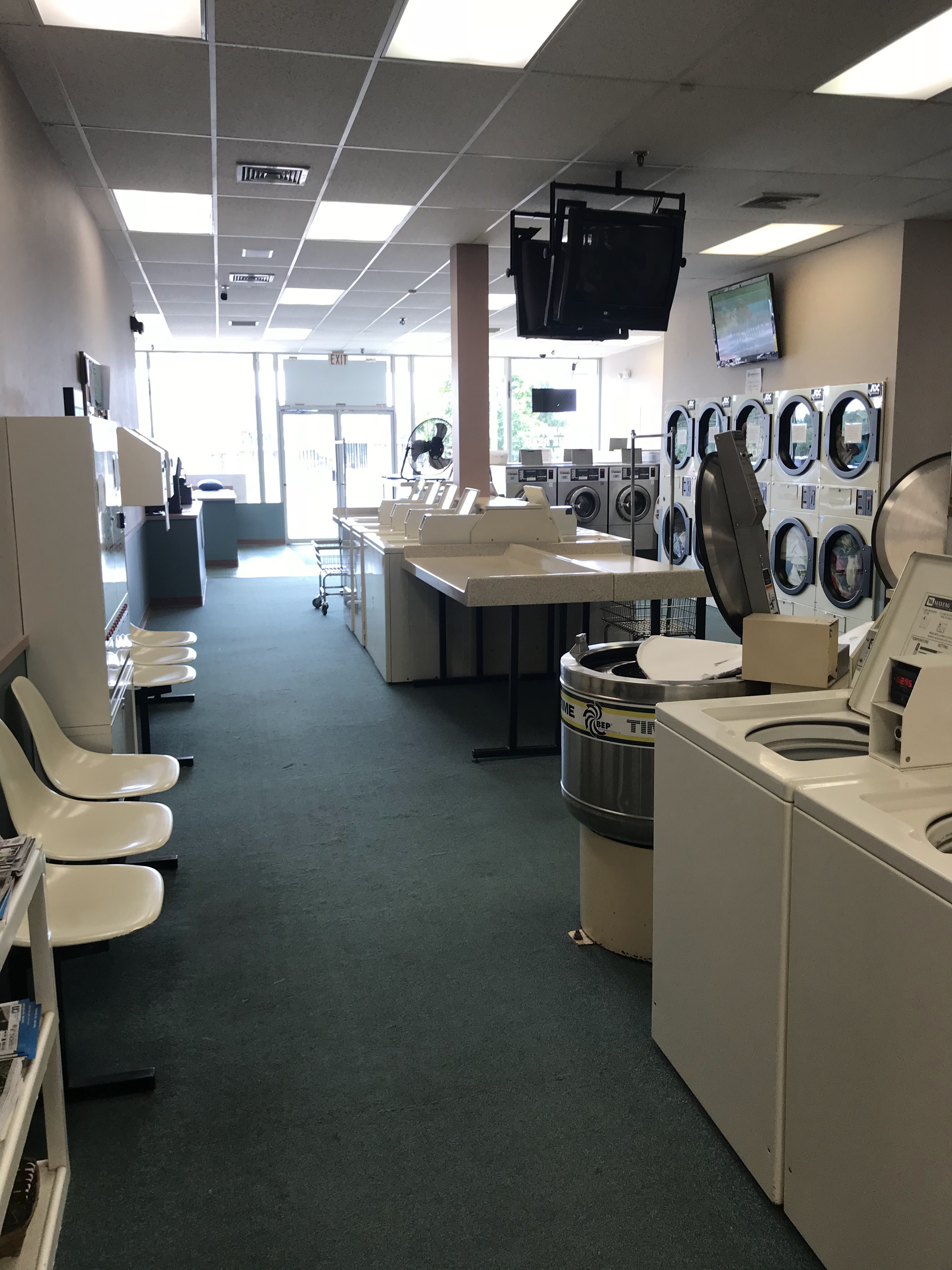 The Laundry Room of Waterford, Pick up and Delivery through third party, Compare at $1.50 per pound! laundromat interior in Waterford, CT