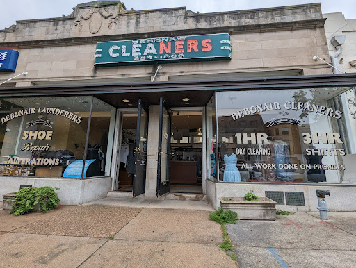Debonair 1 Hour Dry Cleaners Logo